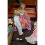 A porcelain doll on stand, modelled as the late Diana, Princess of Wales, Height approximately