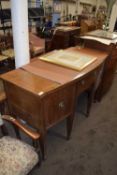 Bow front mahogany sideboard on tapering legs with spade feet