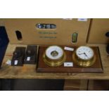 Small modern barometer and clock combination together with a pair of cast metal door stops