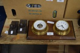 Small modern barometer and clock combination together with a pair of cast metal door stops