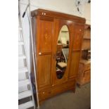 Edwardian mahogany wardrobe with oval mirror to door