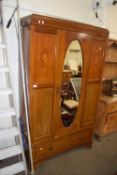 Edwardian mahogany wardrobe with oval mirror to door