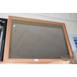 Mirror in rectangular wooden frame