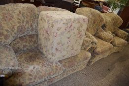 Floral upholstered three piece suite and accompanying footstool