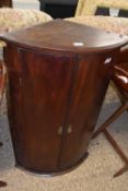 19th Century mahogany bow front corner cabinet with shelved interior