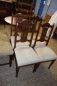 A set of four late Victorian dining chairs