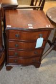 Small reproduction mahogany veneered serpentine front four drawer chest