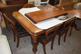 Late Victorian mahogany extending dining table raised on turned legs together with a set of