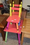 Multi-coloured child's table and two chairs (3)