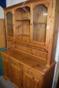 Modern pine dresser cabinet with glazed top section and drawer and cupboard base, 132cm wide