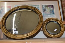 Two reproduction porthole mirrors