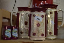 Mixed Lot: Salt and pepper pots and a graduated set of gilt decorated jugs