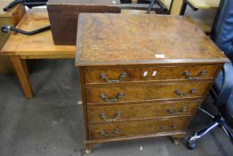 Reproduction walnut veneered four drawer chest