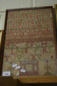 Vintage sampler decorated with rows of letters and numbers signed 'William Craig and Suzanna Craig',