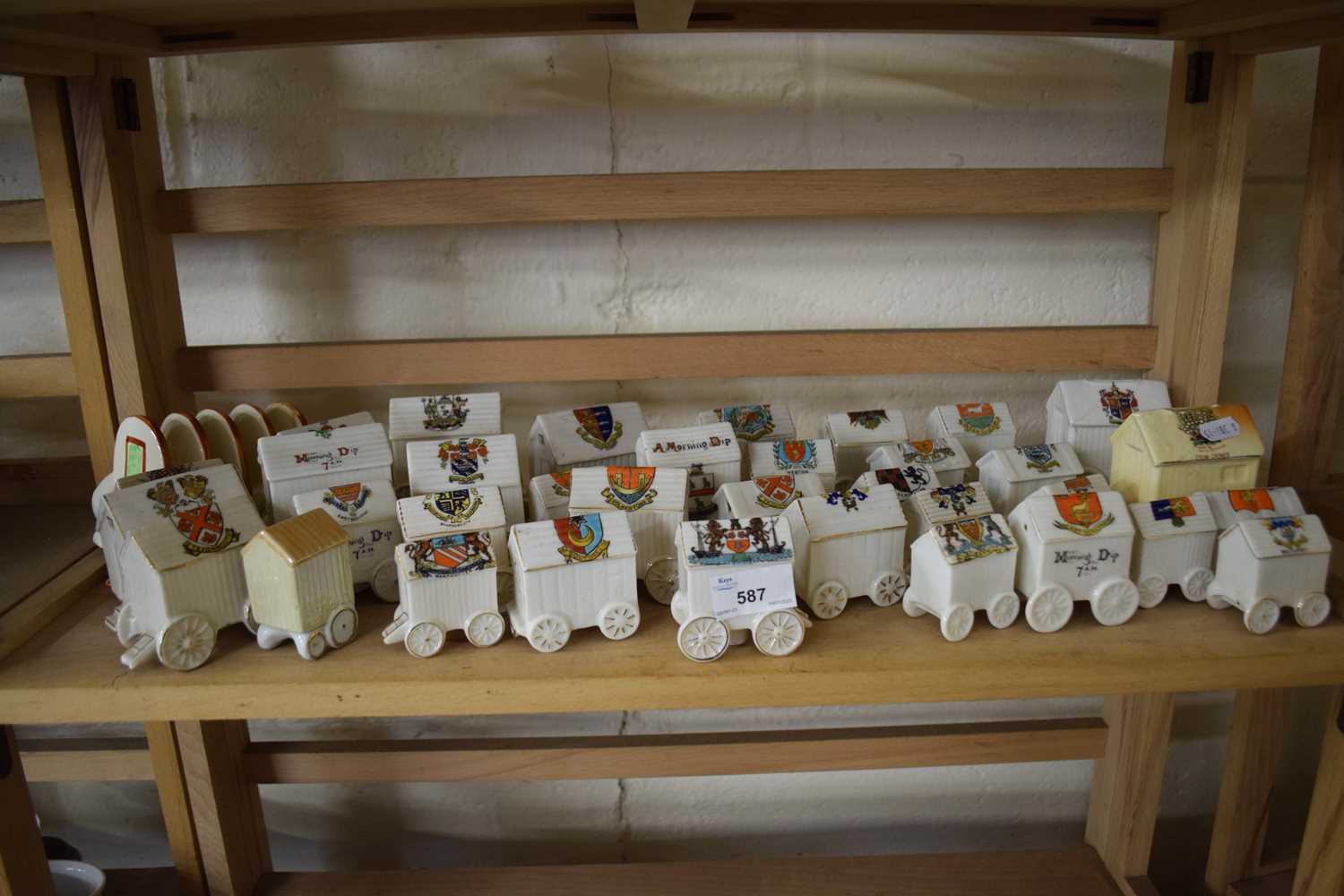 Large collection of crested china model bathing carts with the Arms of various towns around Britain