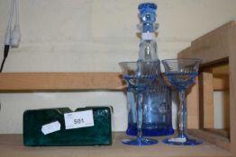 Blue glass spirit decanter with glasses and a further heavy glass ashtray