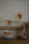Mixed Lot: Peach glass candlesticks, continental figure and a coffee cup and saucer