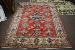 20th Century Pakistani wool rug decorated with geometric design on a red, blue and pale