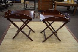 Pair of 20th Century hardwood butlers trays with accompanying stands, the trays with hinged sides,