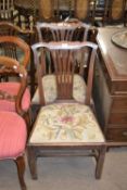 Pair of Hepplewhite period mahogany dining chairs with pierced splat backs and wool work seats