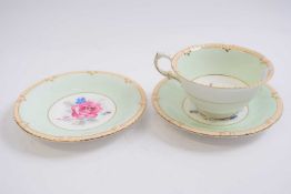 Paragon cup and saucer with floral decoration together with a further saucer same decoration