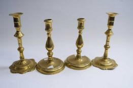 Two pairs of brass candlestick