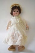 Bisque headed doll by William Goebel, marked 120, in original clothing
