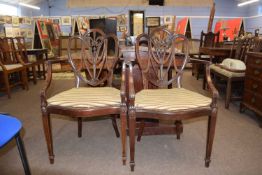 Pair of Georgian style mahogany armchairs with shaped back with fleur de lis decoration over cane