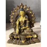 Gilt bronze figure of a Buddha in classical pose