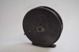 Vintage metal fishing reel with line