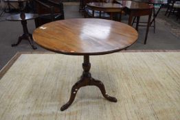Georgian mahogany supper table with circular top raised on turned column and tripod base, 81cm