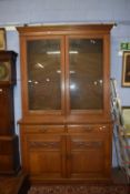 Late Victorian light oak bookcase cabinet with glazed top section with adjustable shelves over a