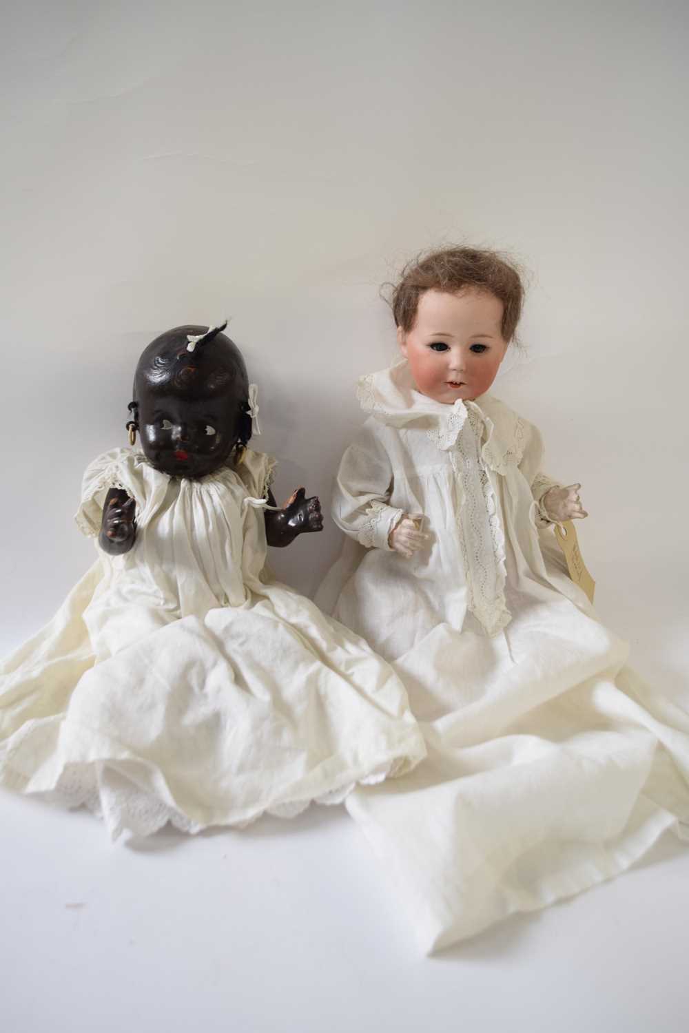 Two further dolls, one with a Heubach bisque head, the second doll marked Reliable Doll Company,