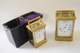 Two brass carriage clocks, one with original case