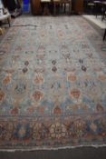 Large caucasian faded wool carpet with medallion design approx 21 ft x 11 ft