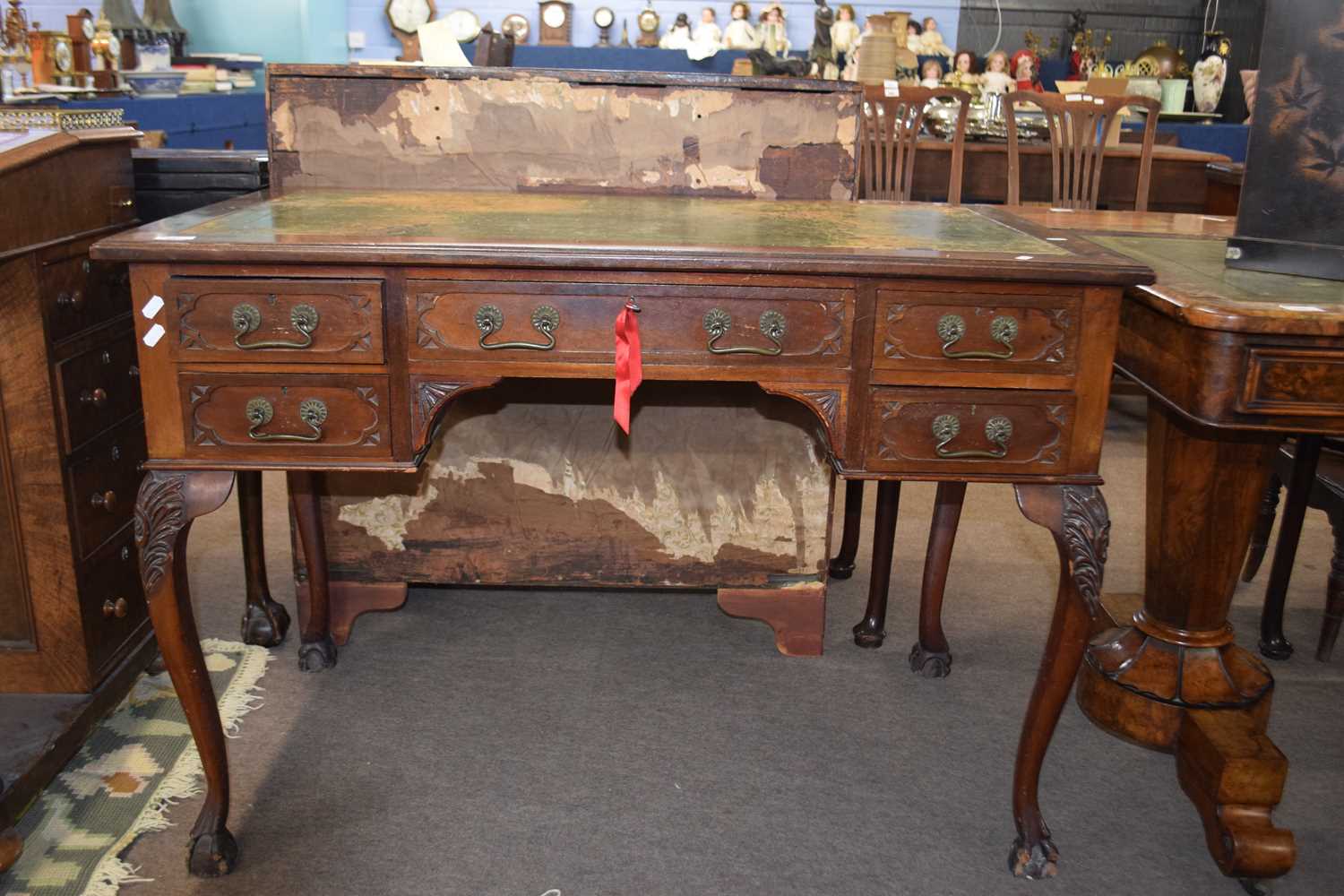 Late 19th or early 20th Century mahogany writing table with green tooled leather surface over five