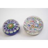 Two paperweights, one Perthshire with blue and green canes