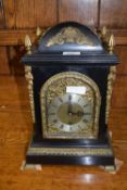 A late 19th Century bracket clock with ebonised case with applied metal mounts, the dial signed '