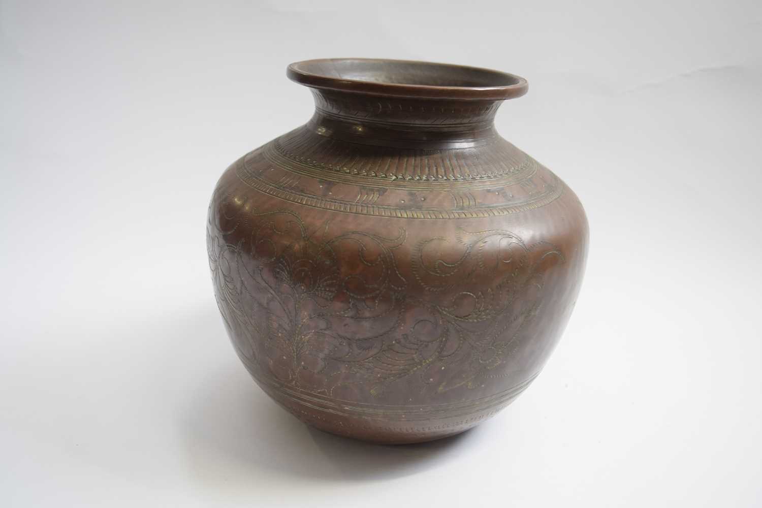 Copper pot with a incised foliage design, 17cm high