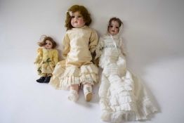 Group of three small dolls with German bisque heads, one marked S&H for Hanna, Germany, with