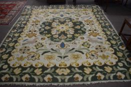 Large 20th Century flat weave rug possibly of Spanish origin decorated with a floral border and