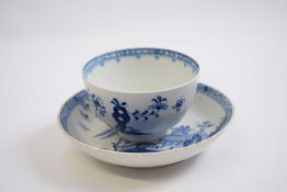 Lowestoft tea bowl and a saucer, both with blue and white designs