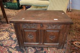 Small 18th Century oak coffer with two panelled front with carved floral detail, 69cm wide