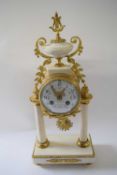 Mantel clock in French Empire style with alabaster columns on rectangular alabaster style base,