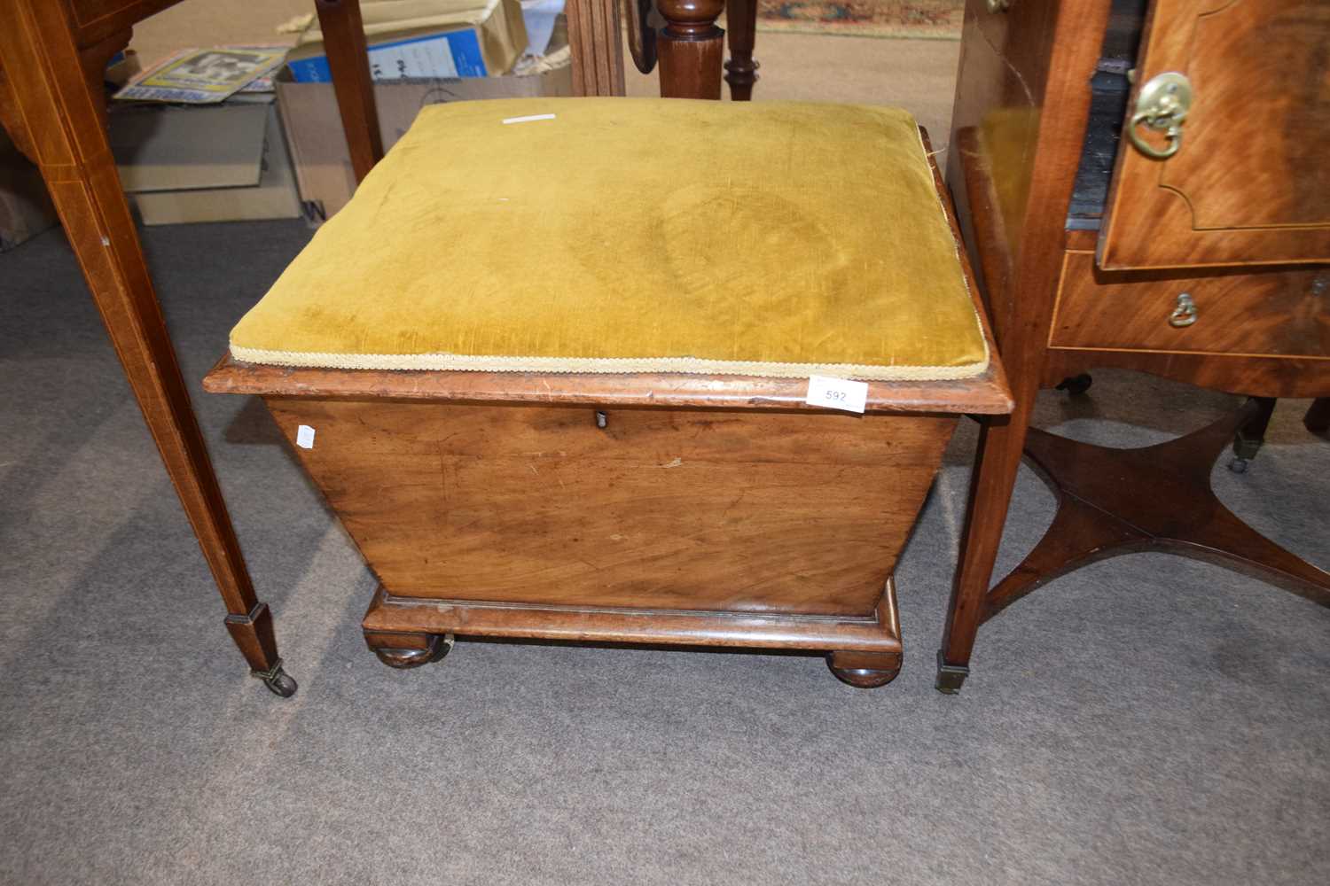 19th Century storage footstool with upholstered hinged lid over a tapering body raised on casters, - Image 2 of 2