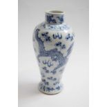 19th Century Chinese porcelain vase decorated in blue and white with a dragon chasing the flaming