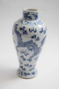 19th Century Chinese porcelain vase decorated in blue and white with a dragon chasing the flaming