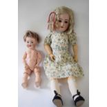 Simon & Halbig doll in original clothing together with a smaller doll marked AB (2)