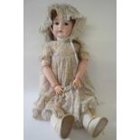German bisque headed doll in original clothing