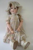 German bisque headed doll in original clothing